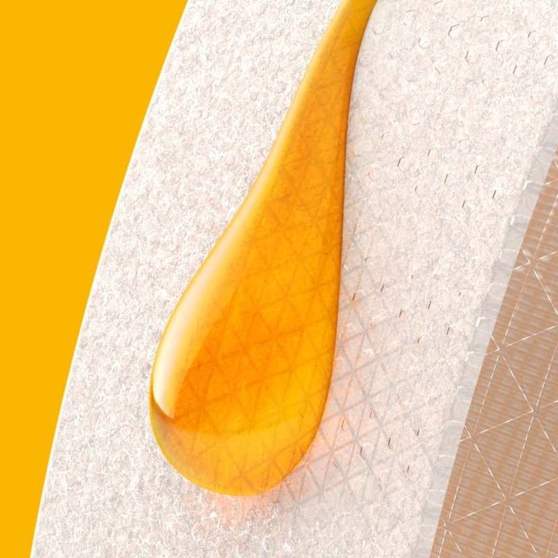 A wax plaster with a small amount of honey on it, on a yellow background.