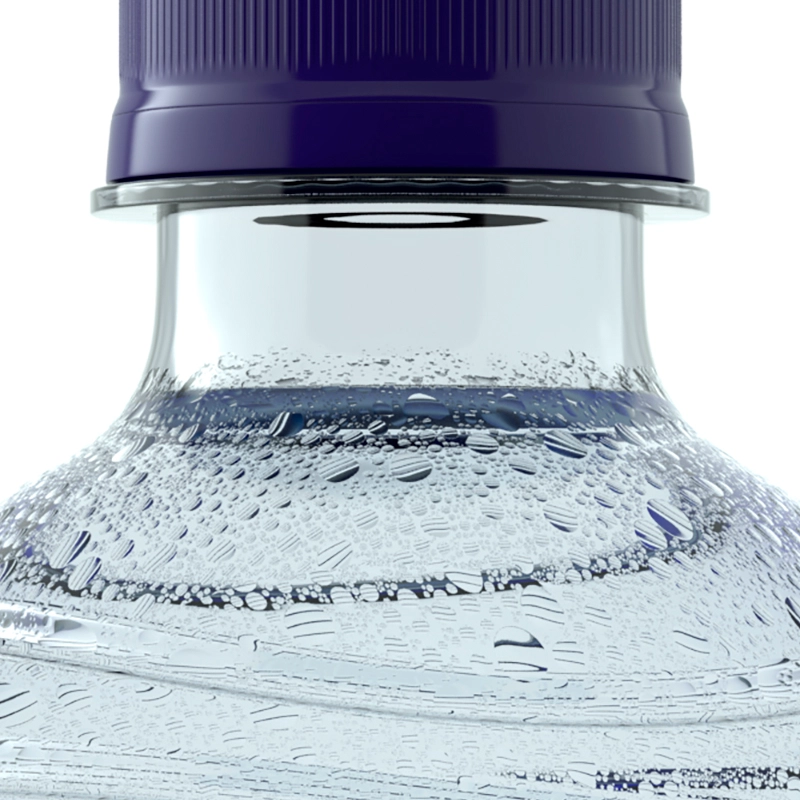 A close-up of a Pump plastic water bottle with a dark blue cap and condensation on the sides.