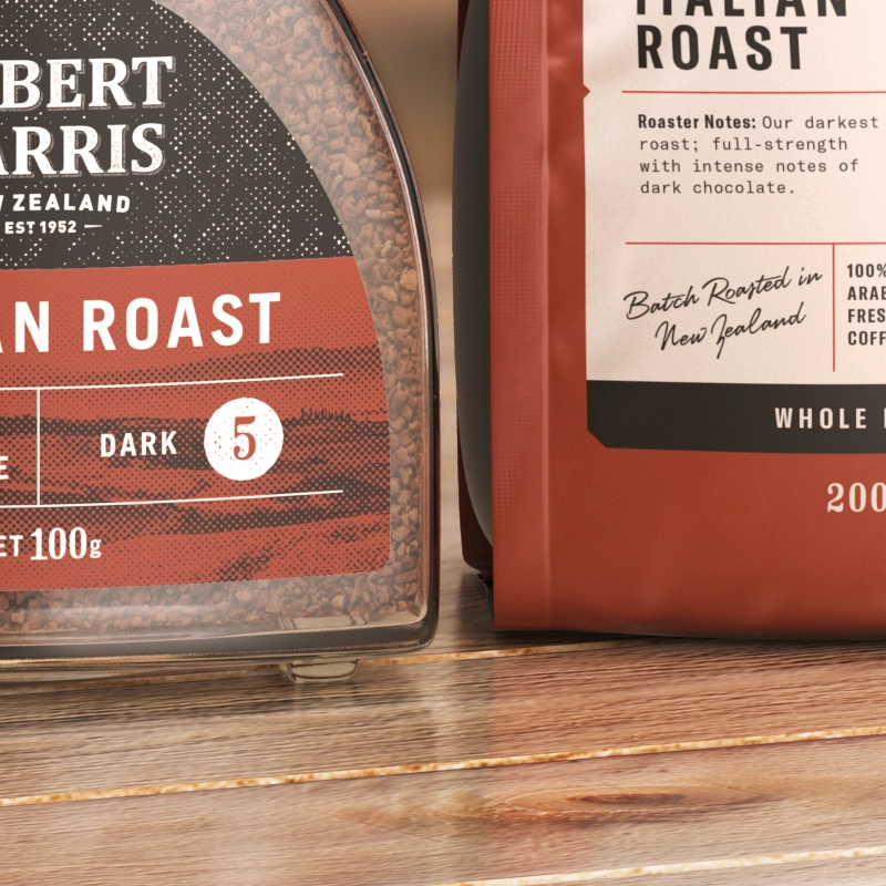 Closeup of two Robert Harris Italian Roast coffee products, one in a jar and one in a bag, with information about the roast and origins.