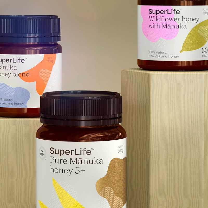 Three jars of SuperLife honey: Manuka Honey Blend, Wildflower Honey with Manuka and Pure Manuka Honey 5+.