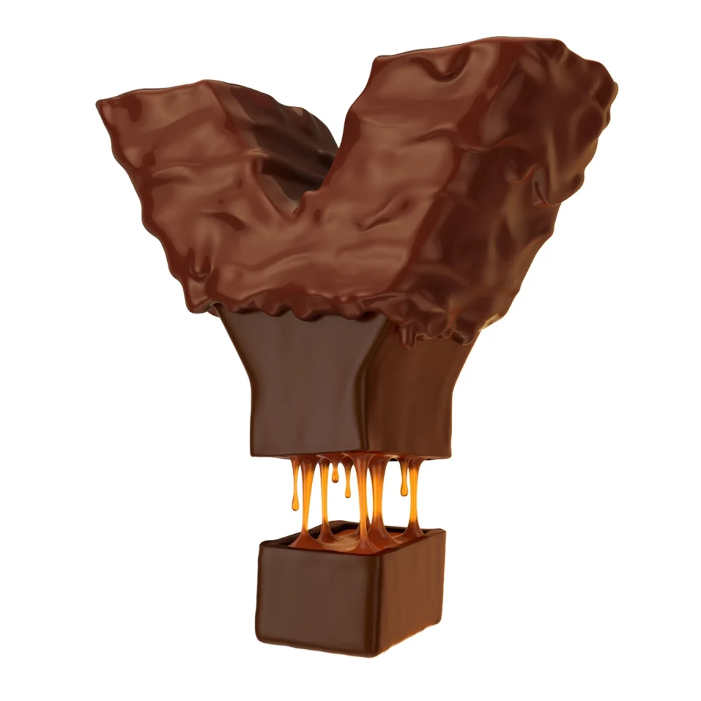 A chocolate letter "Y" with sticky caramel inside with melted chocolate dripping down.
